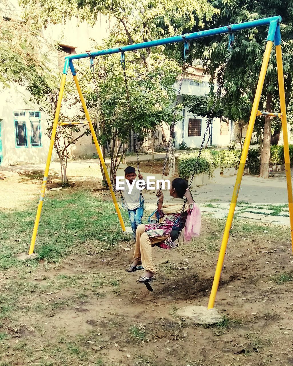 CHILDREN PLAYING ON PLAYGROUND