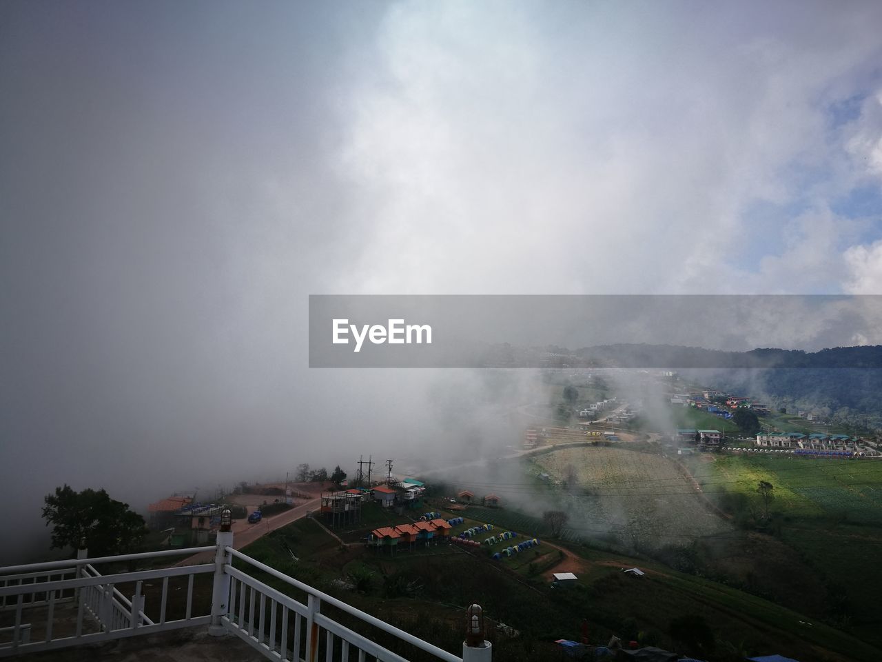 PANORAMIC VIEW OF LANDSCAPE AND SMOKE AGAINST SKY