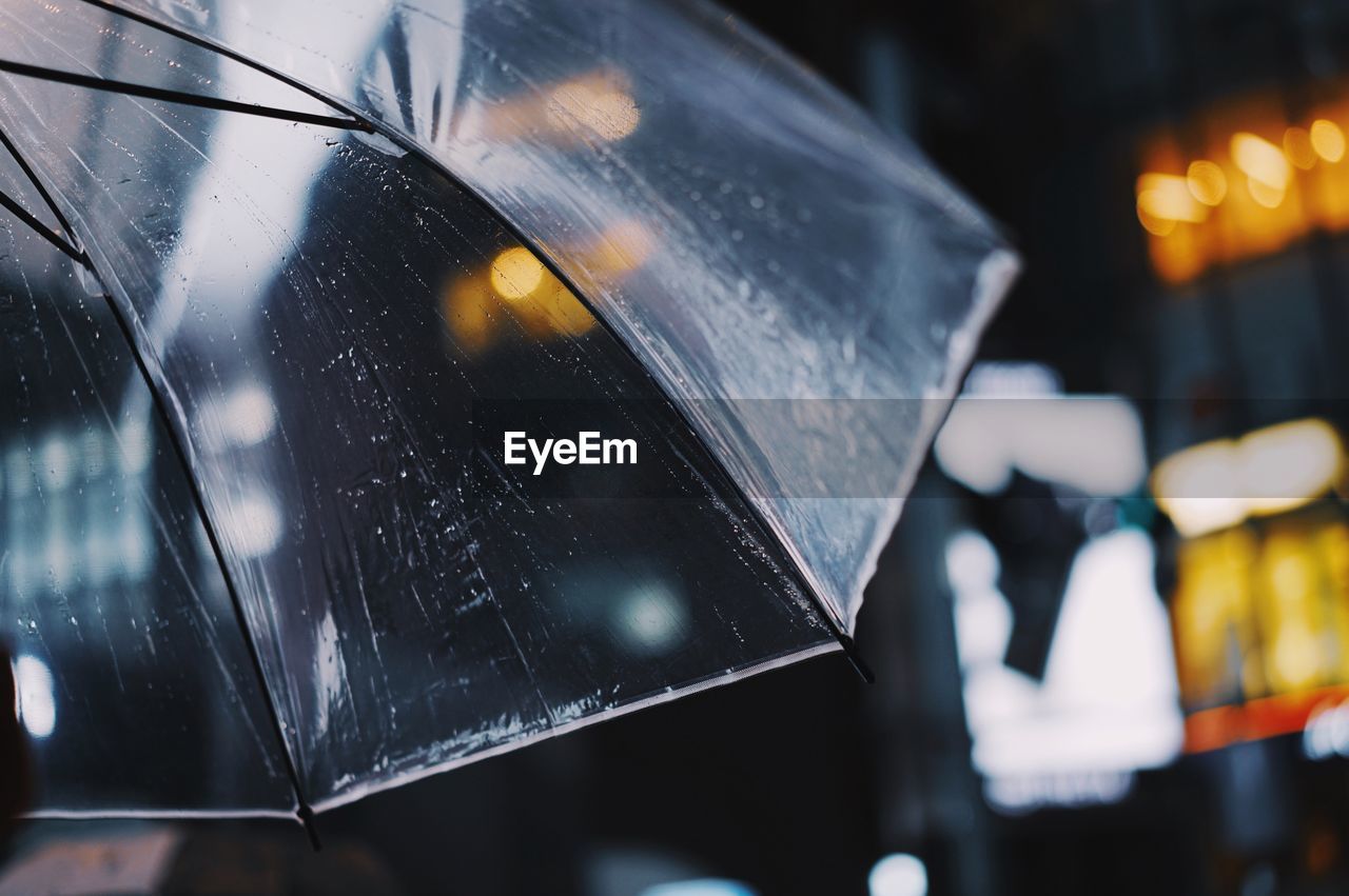 Close-up of wet umbrella during rainy season