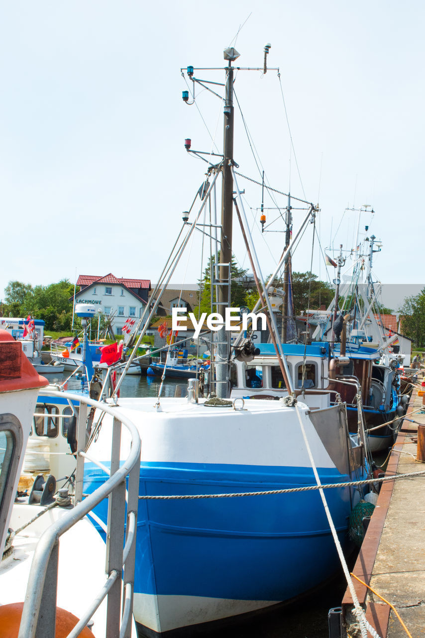 Boats moored at harbor