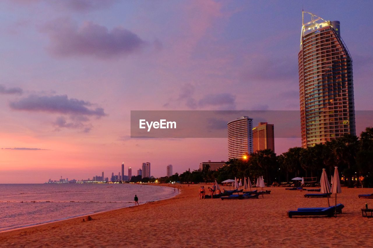 SCENIC VIEW OF BEACH AGAINST SKY DURING SUNSET