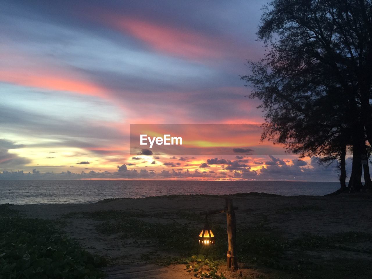 Scenic view of sea against sky at sunset