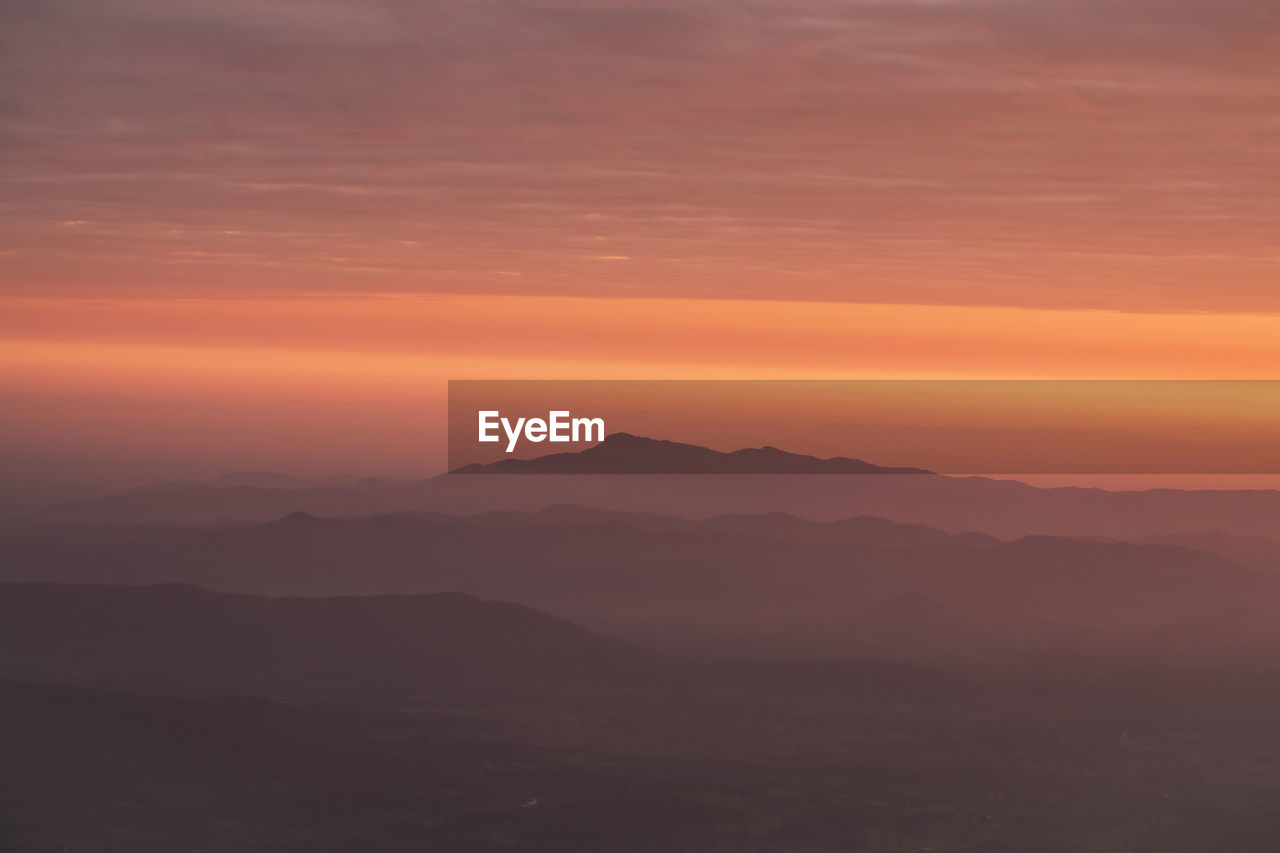 Layer of mountains with misty in morning