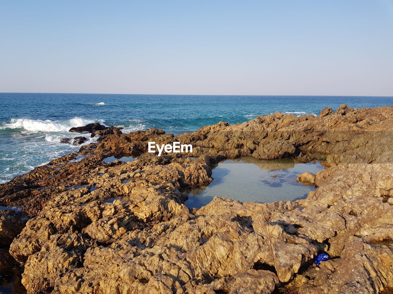 Scenic view of sea against clear sky