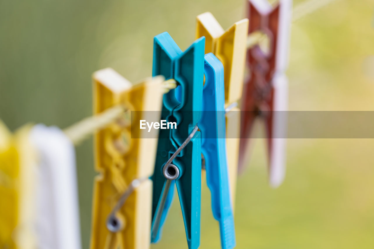 Close up of colourful clothes pegs on a washing line
