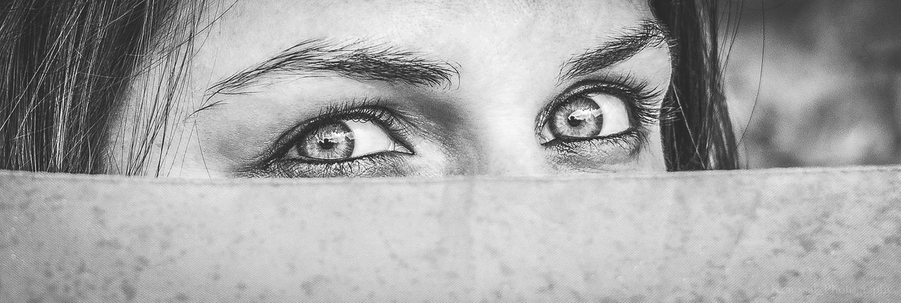 PORTRAIT OF BEAUTIFUL YOUNG WOMAN HIDING BEHIND FACE