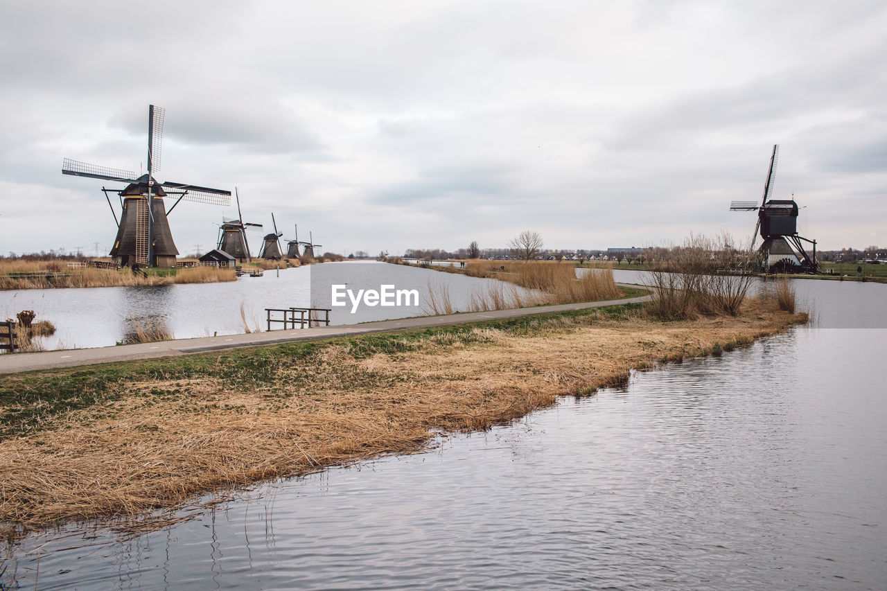 TRADITIONAL WINDMILL BY RIVER