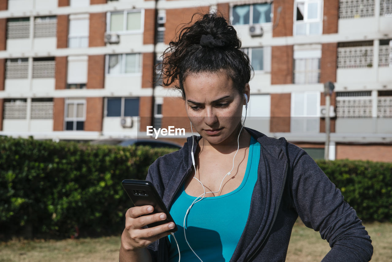 Angry woman using her mobile