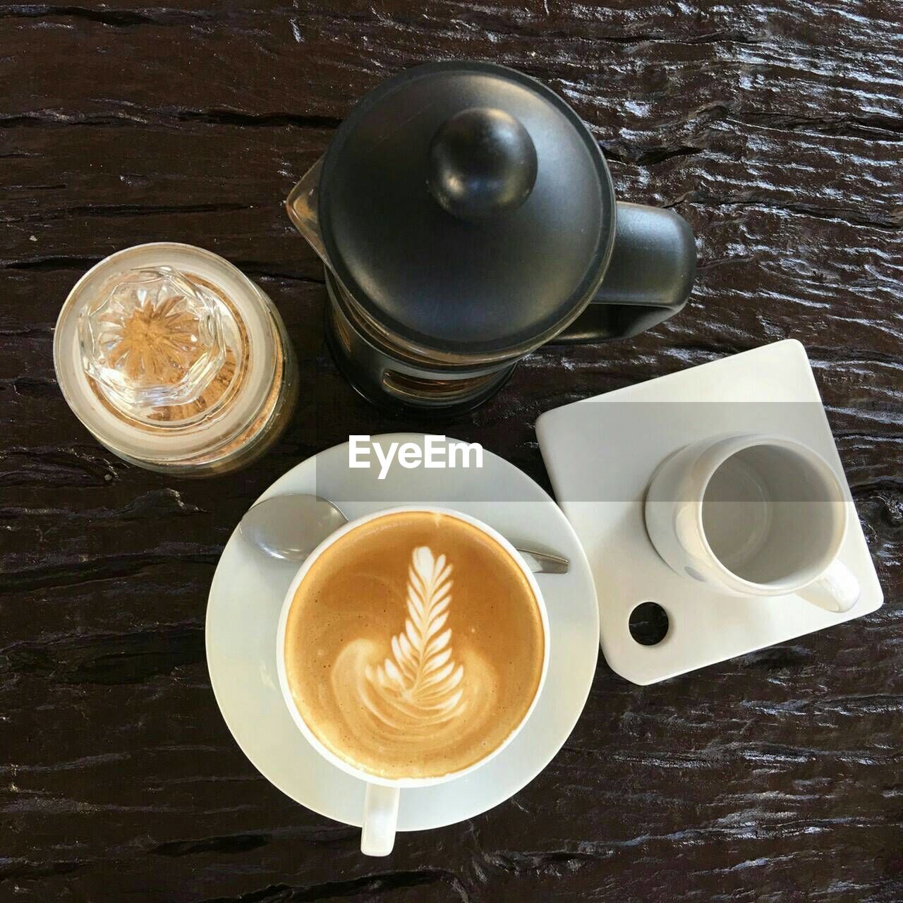 HIGH ANGLE VIEW OF COFFEE ON TABLE IN CAFE