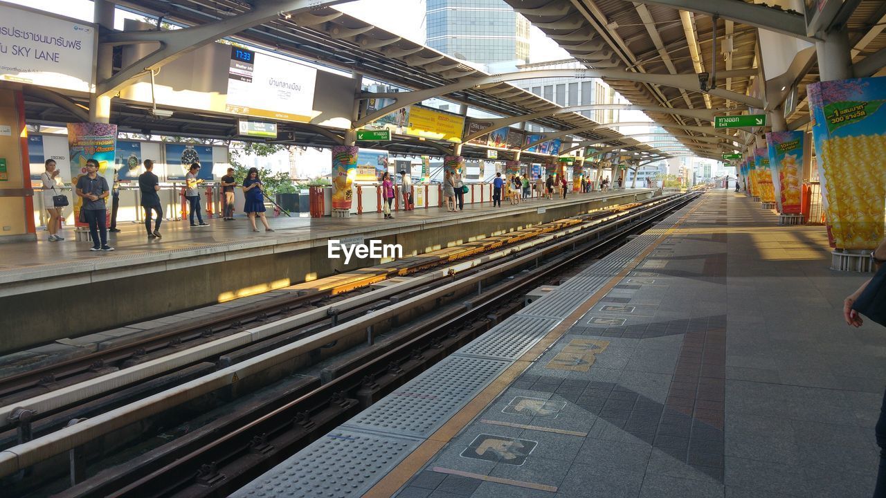People at railroad station platform