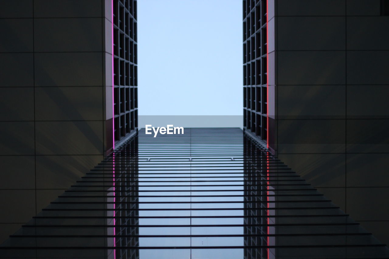 Low angle view of modern building against clear sky