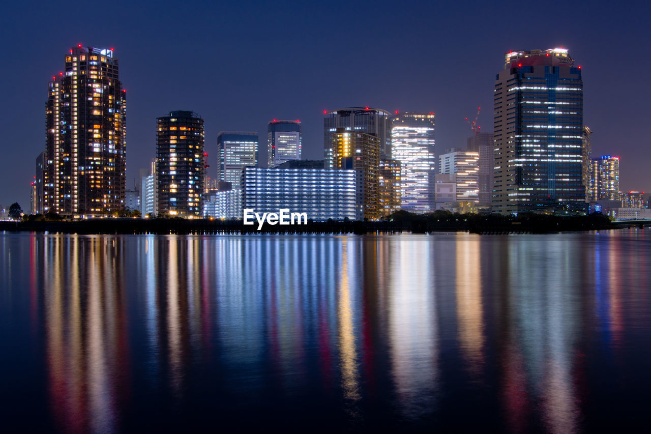 Illuminated buildings in city at night