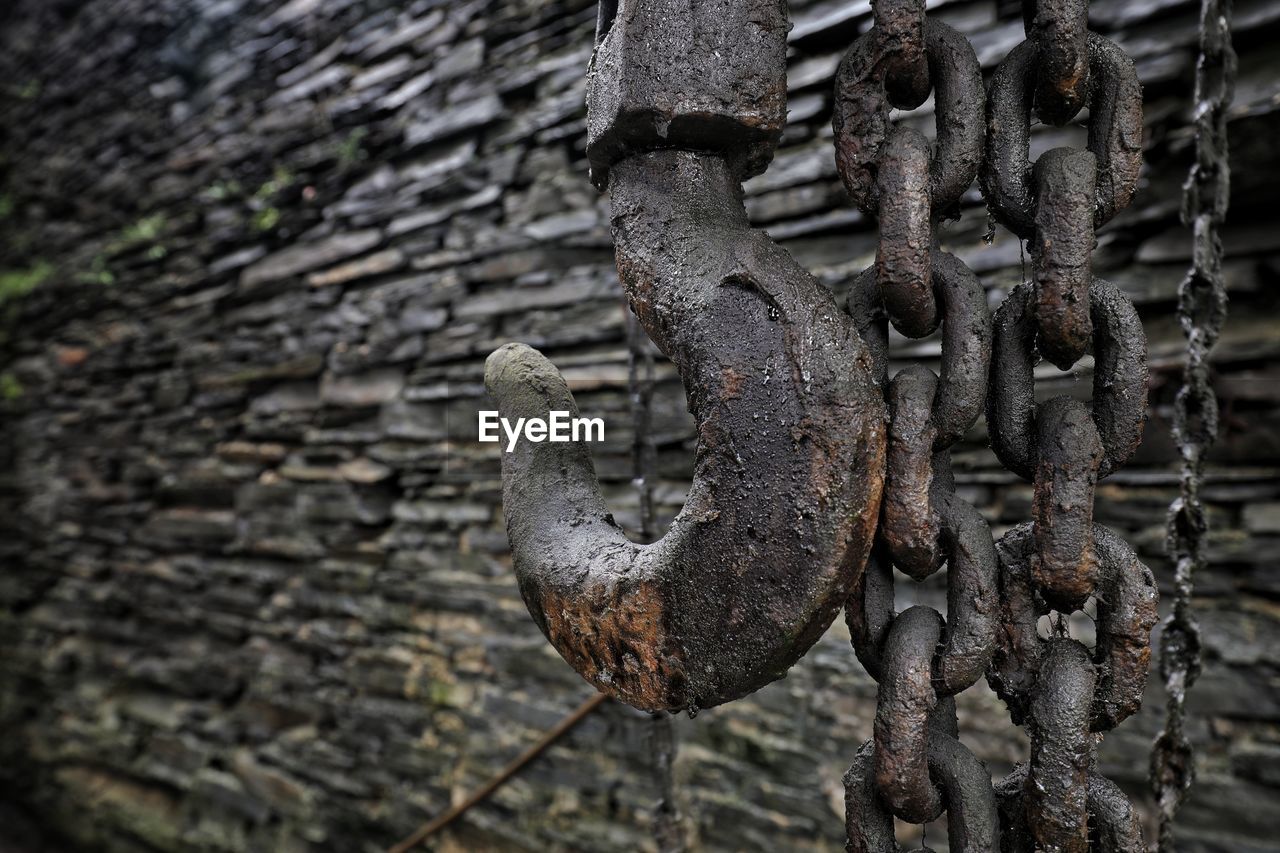 Close-up of rusty chain with hook