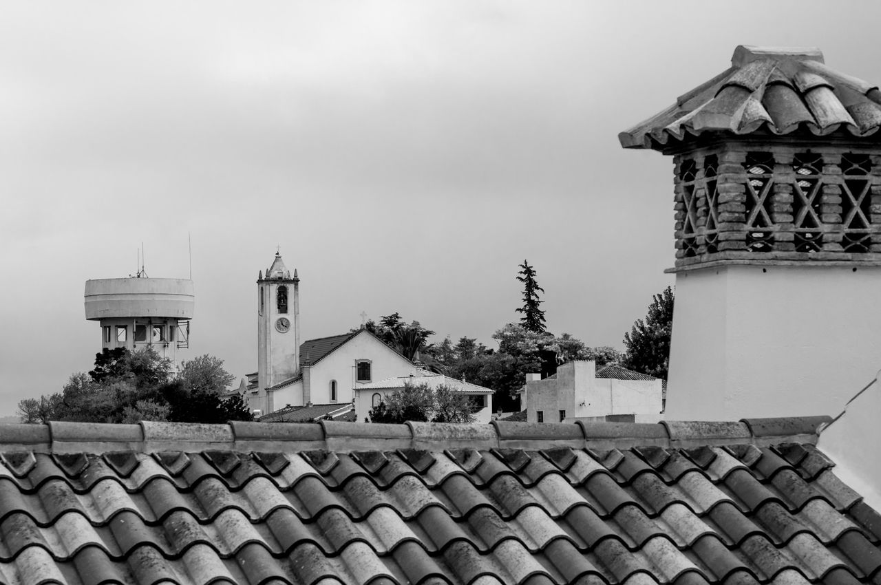 View of tower over roofs