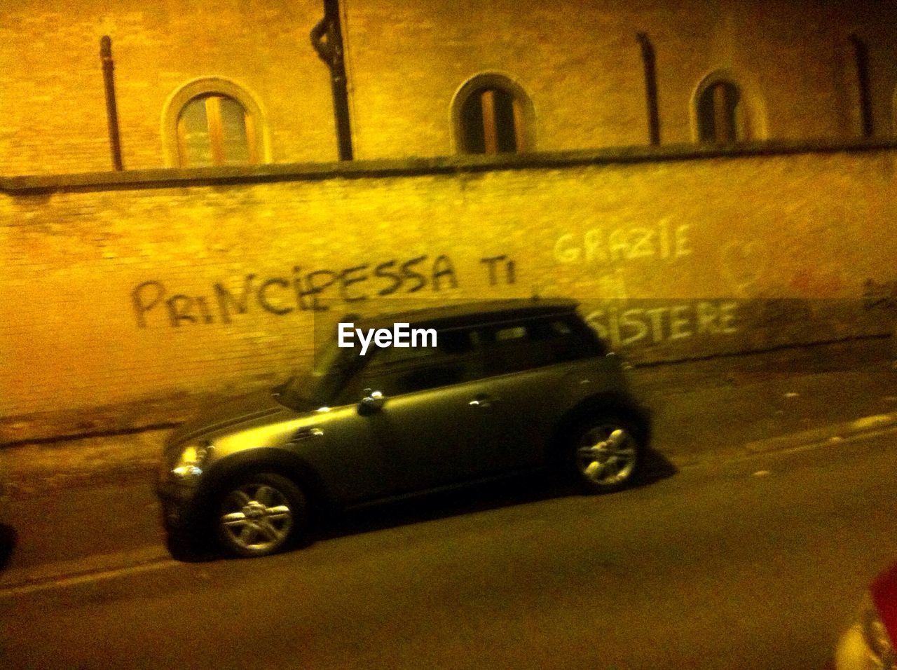 VIEW OF YELLOW CAR ON ROAD