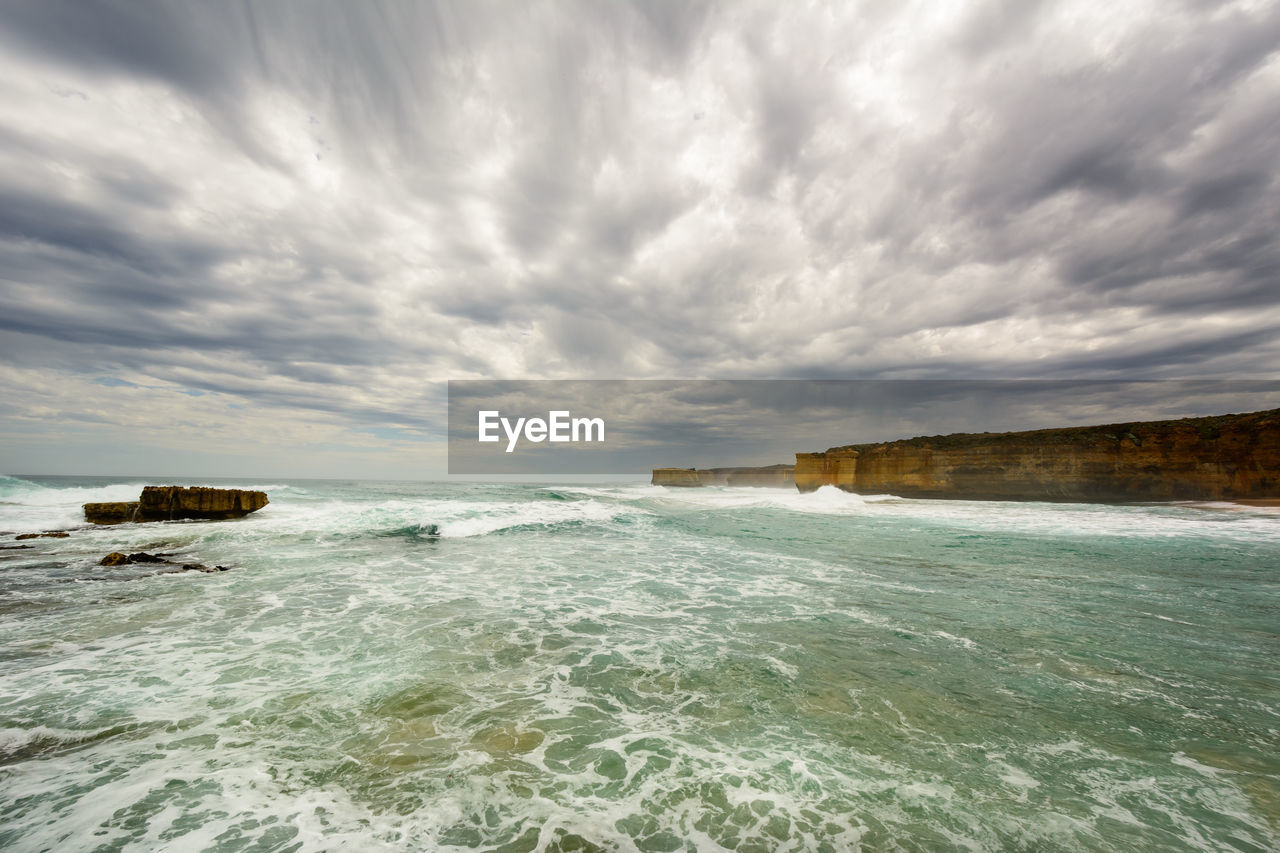 Scenic view of sea against cloudy sky