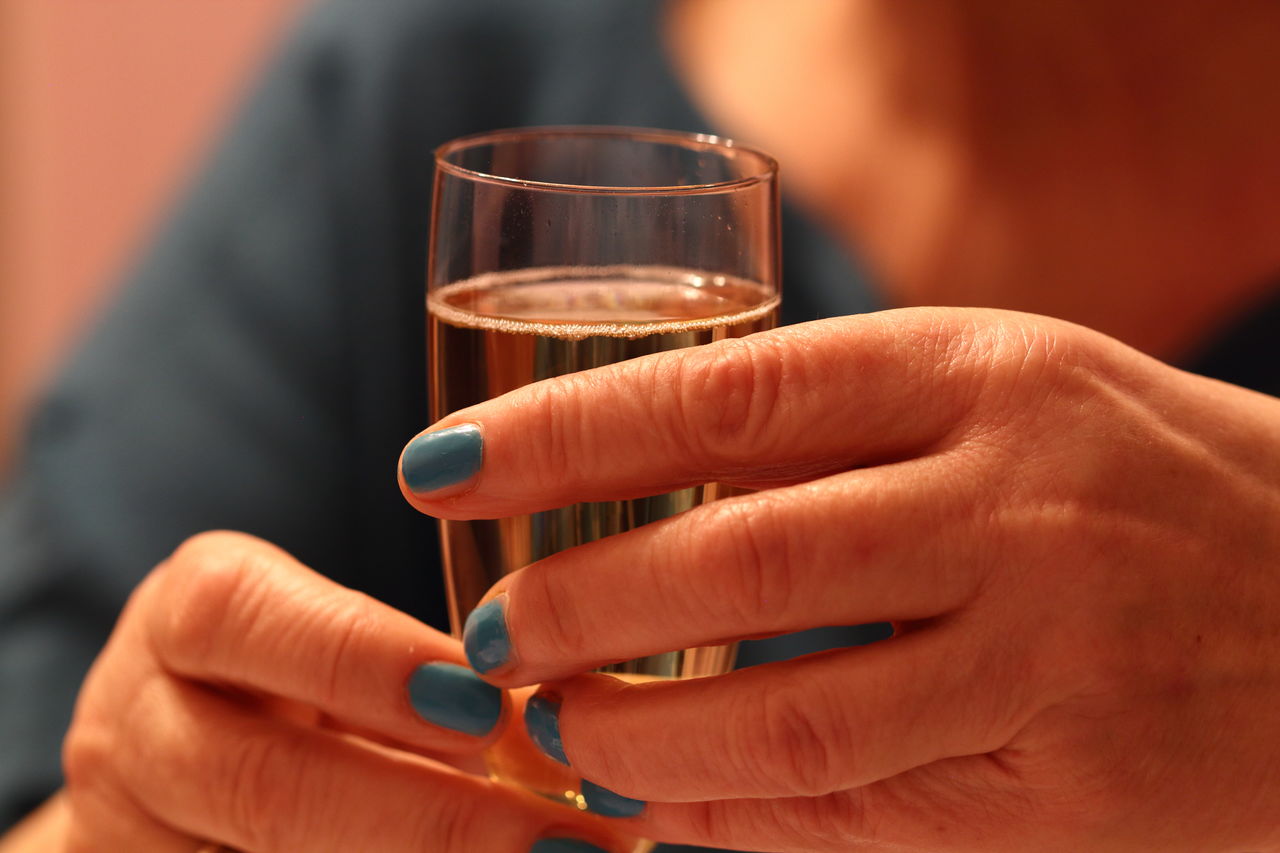 Cropped image of woman holding wine