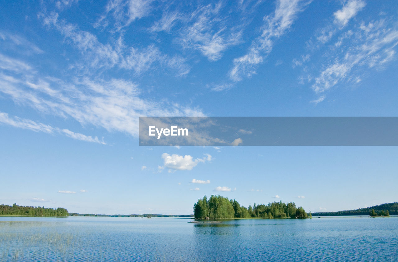 VIEW OF LAKE AGAINST BLUE SKY