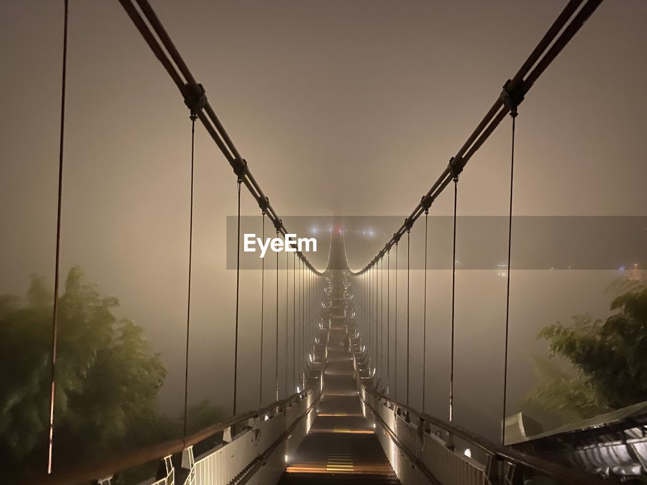 View of suspension bridge in foggy weather