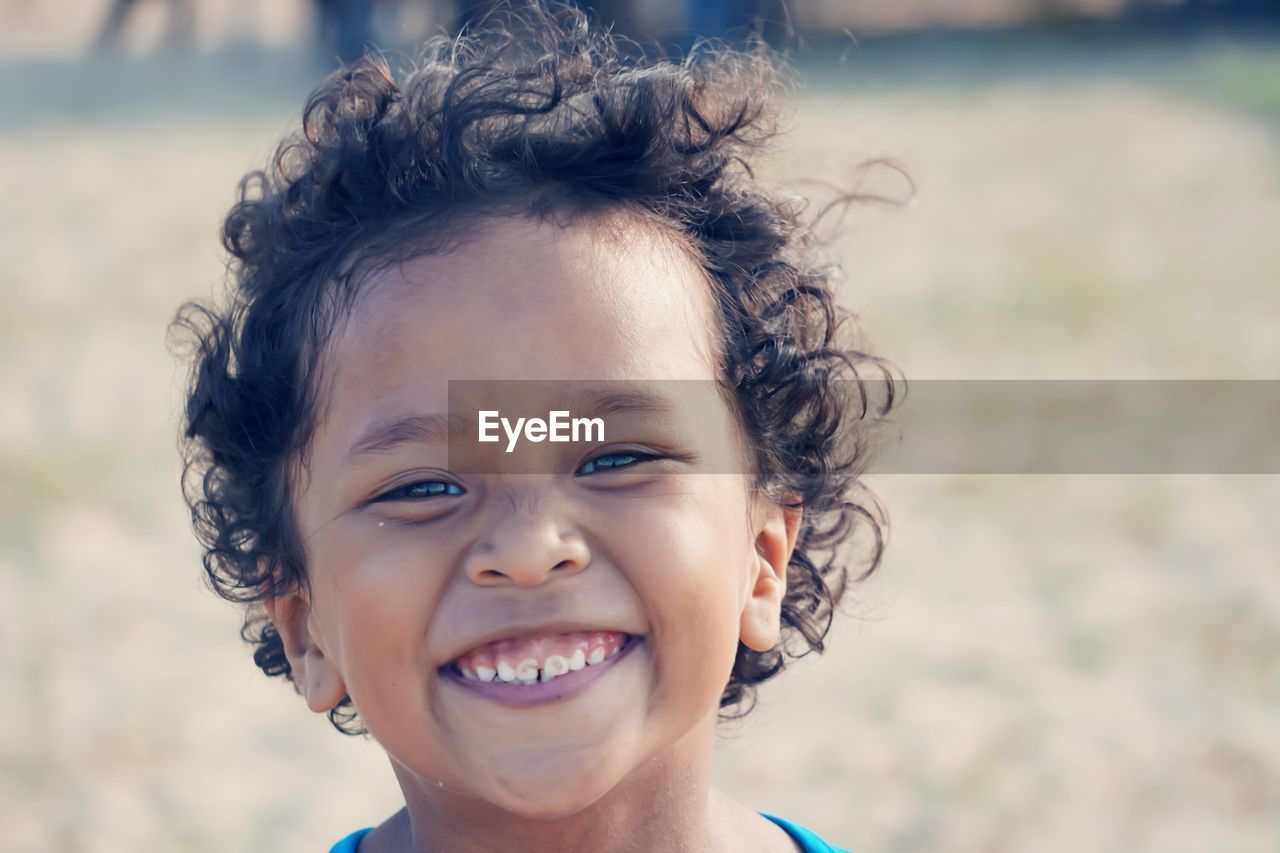 Close-up portrait of cute smiling boy