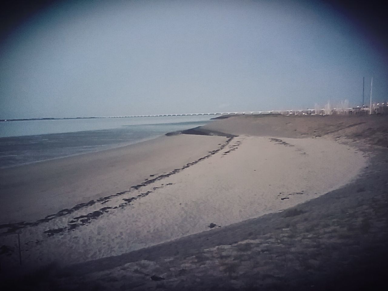 VIEW OF BEACH AGAINST CLEAR SKY