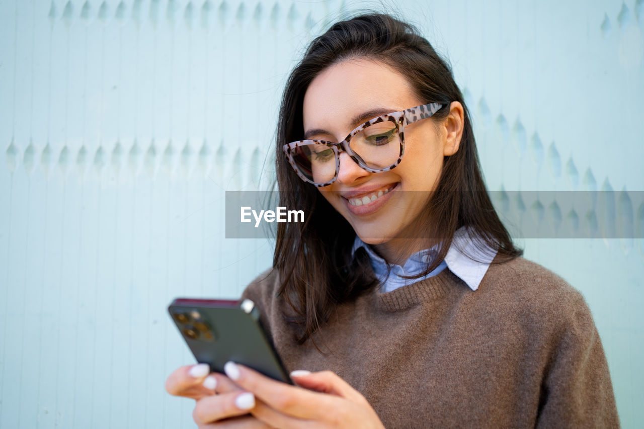 portrait of woman using mobile phone