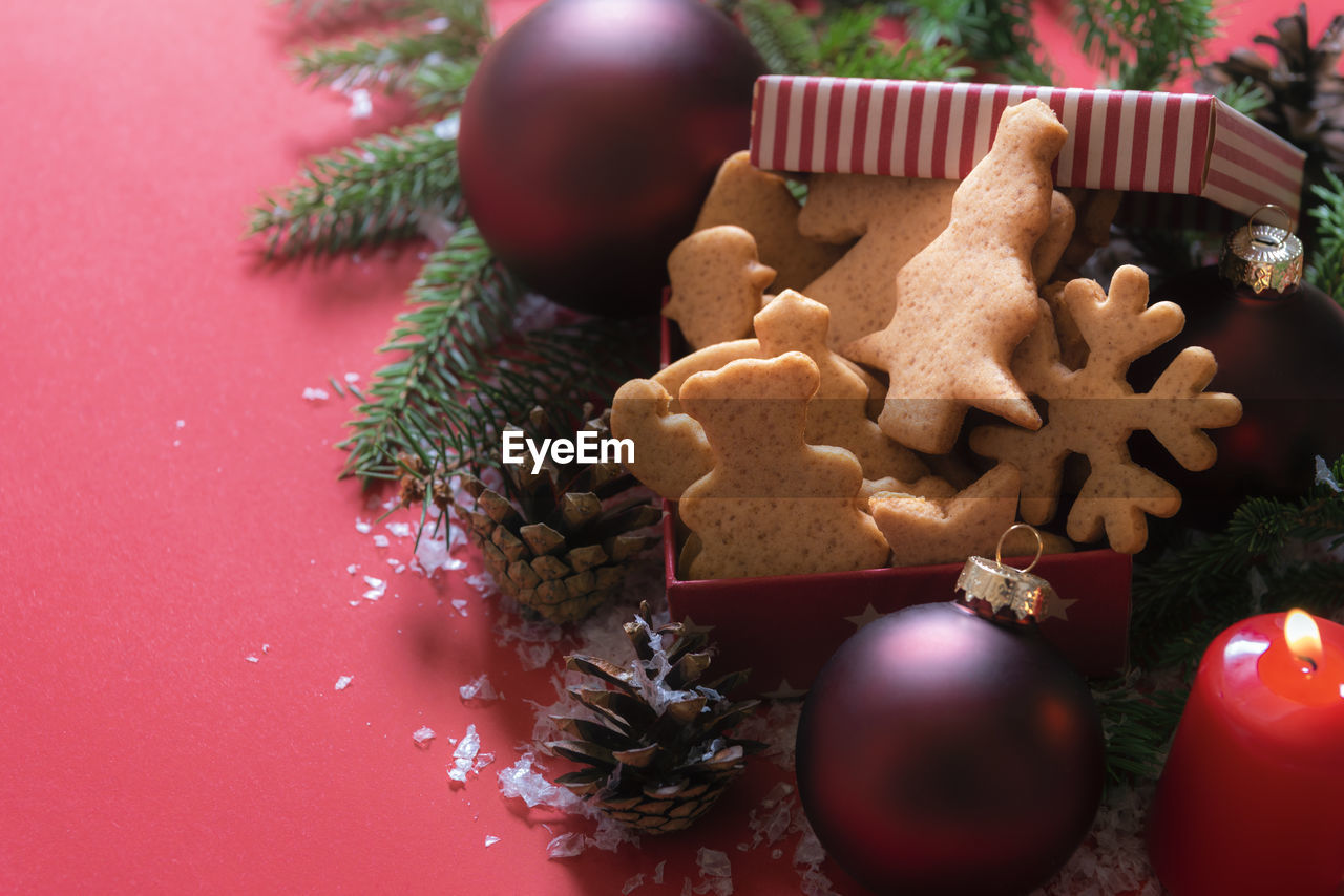High angle view of cookies with christmas decoration on table