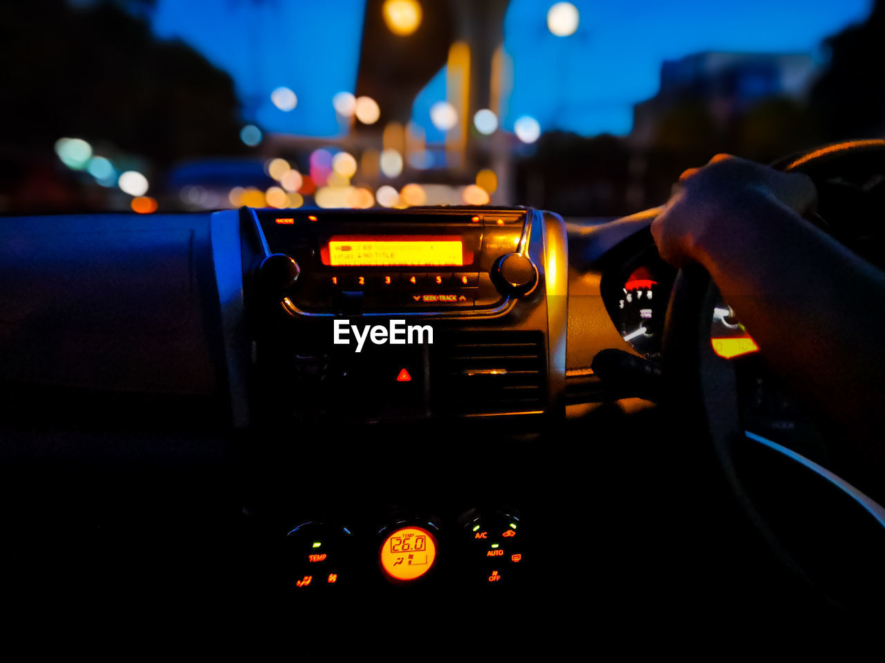 CLOSE-UP OF HAND HOLDING CAR