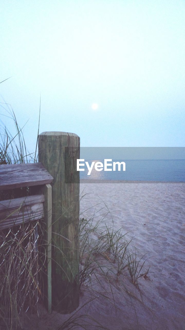 Wooden post on beach