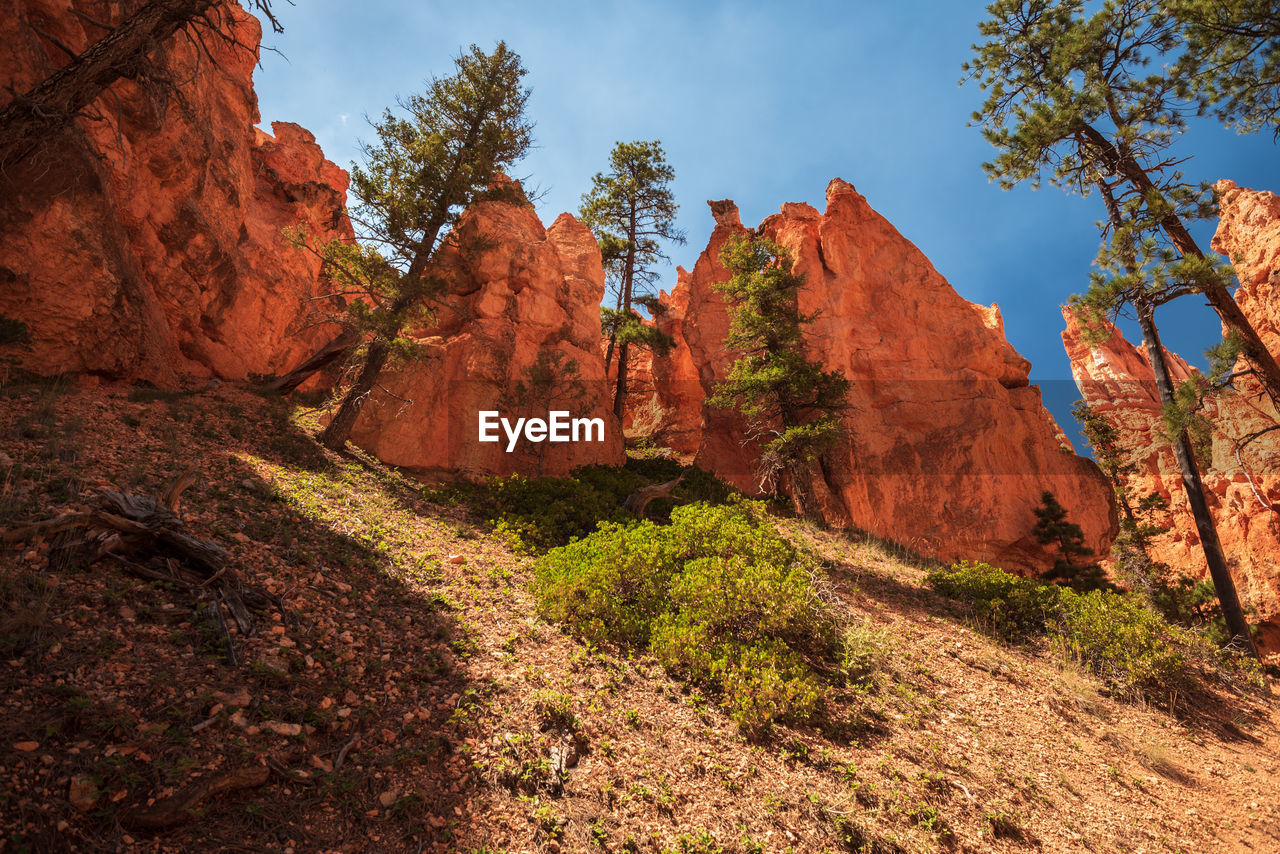 ROCK FORMATIONS ON MOUNTAIN AGAINST SKY