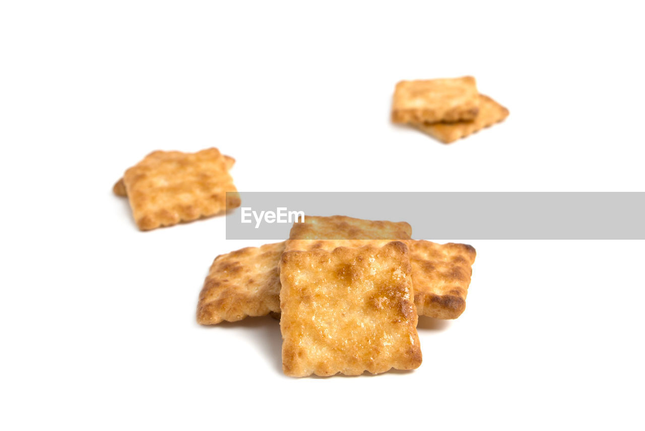 Stack of biscuits against white background