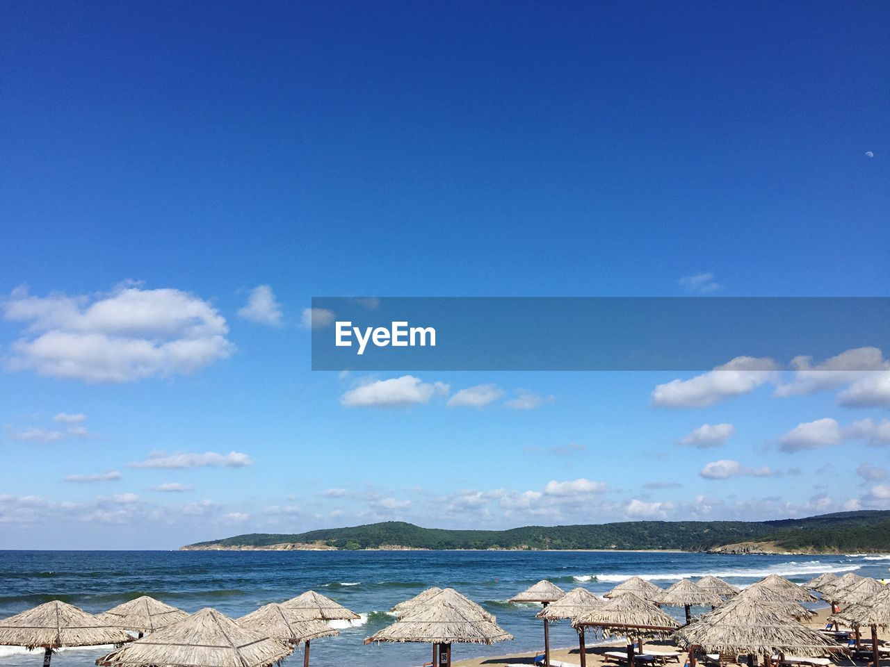 Scenic view of sea against blue sky