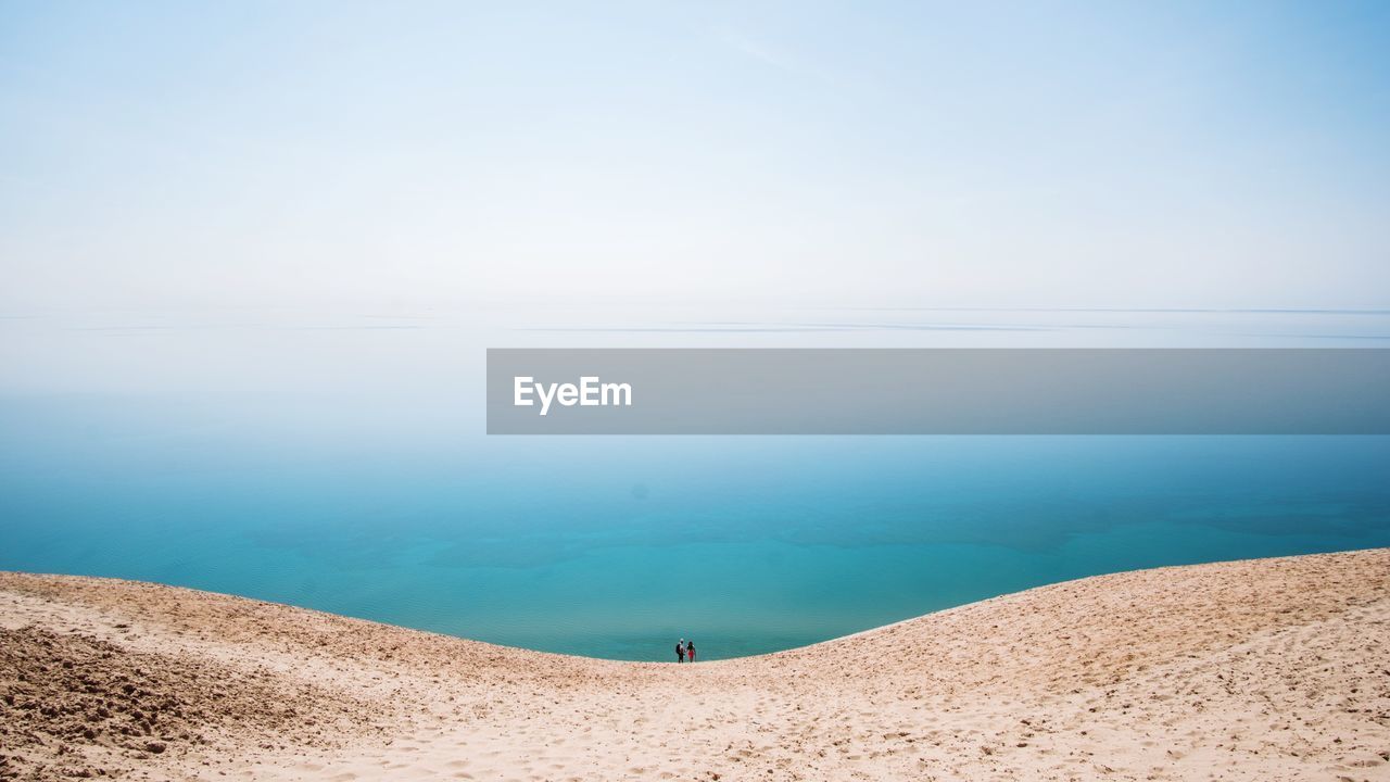 Sand dune with sky in background