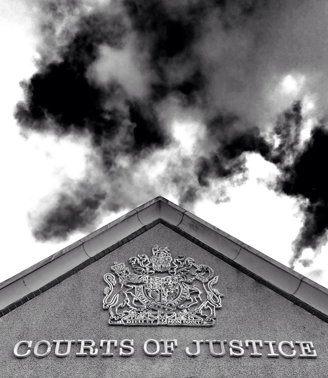 LOW ANGLE VIEW OF SIGN BOARD AGAINST CLOUDY SKY