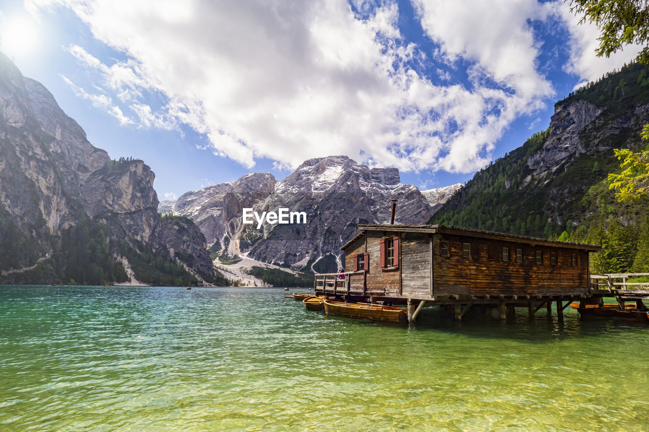 SCENIC VIEW OF LAKE WITH MOUNTAIN IN BACKGROUND