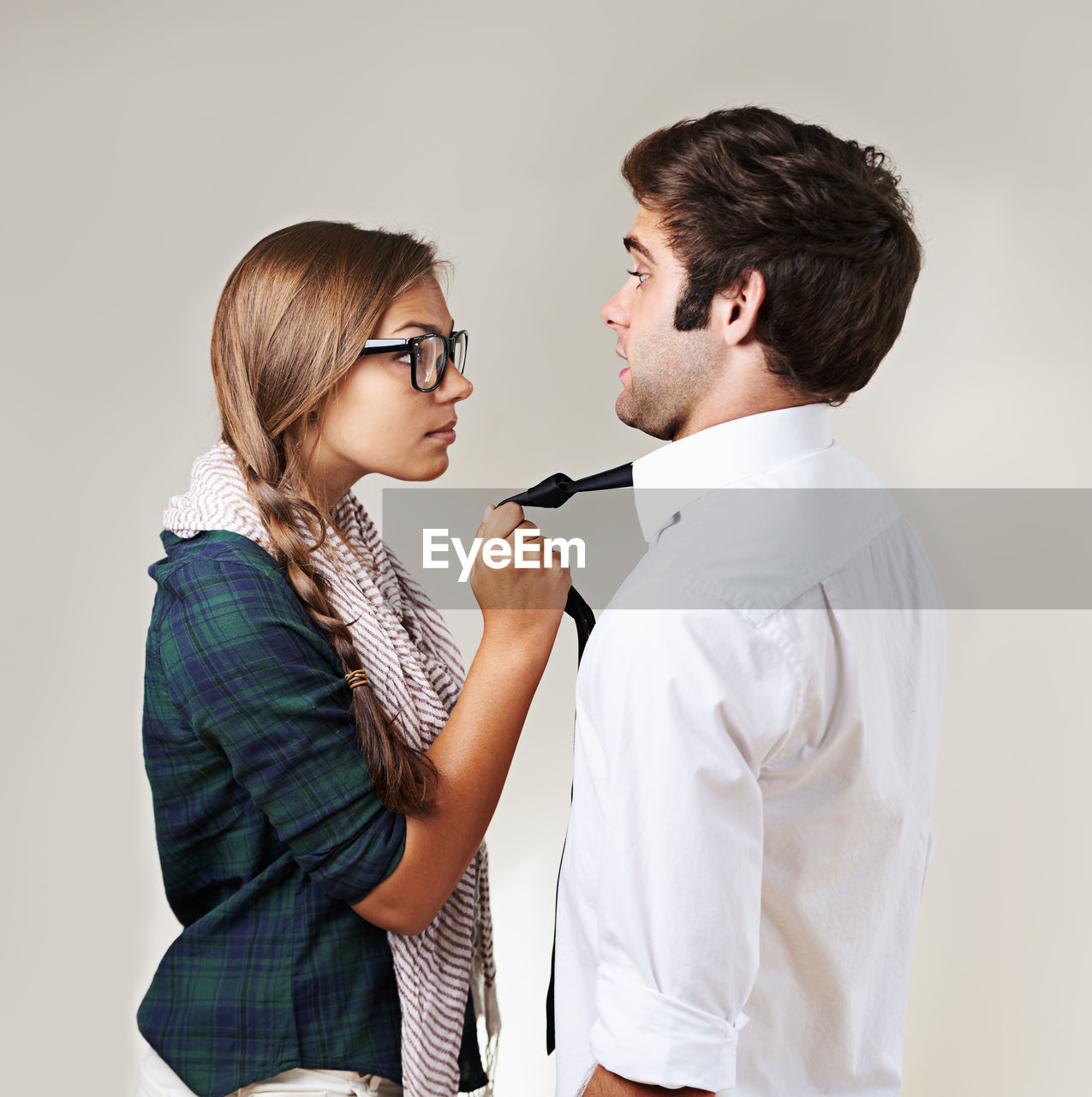 two people, adult, women, indoors, men, photo shoot, young adult, studio shot, clothing, person, emotion, togetherness, female, positive emotion, casual clothing, waist up, standing, glasses, love, side view, fashion, business, human face, eyeglasses