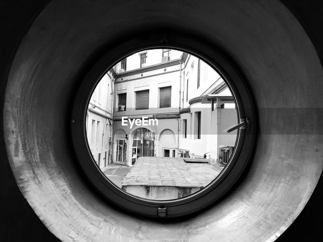 REFLECTION OF BUILDINGS ON WINDOW