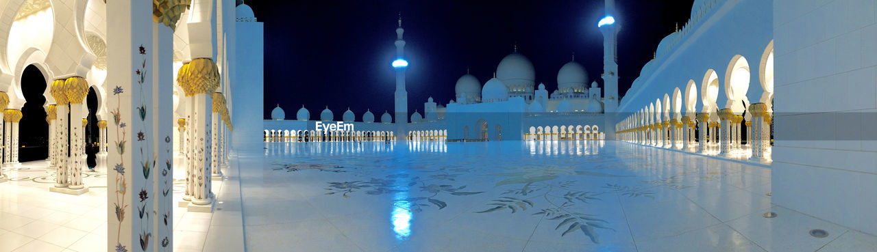 REFLECTION OF ILLUMINATED BUILDINGS IN WATER