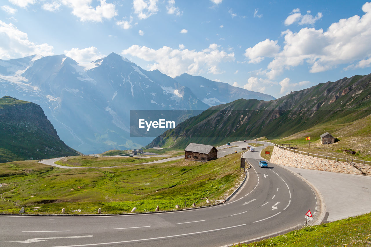 ROAD AMIDST LANDSCAPE AGAINST SKY