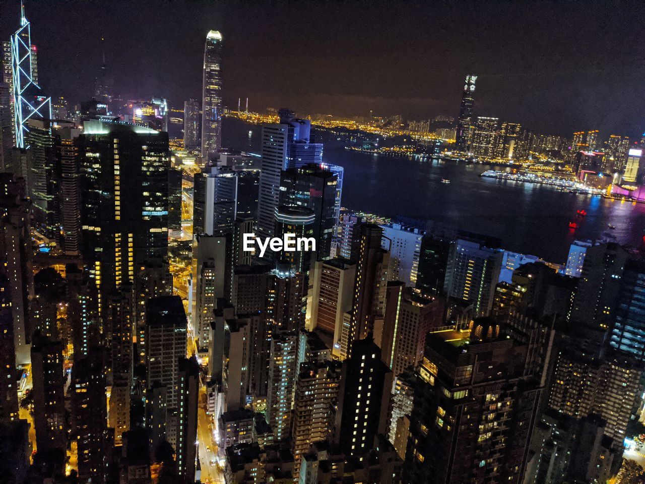 Aerial view of illuminated buildings in city at night