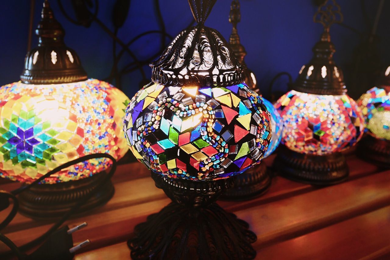 Illuminated decorative lanterns on table