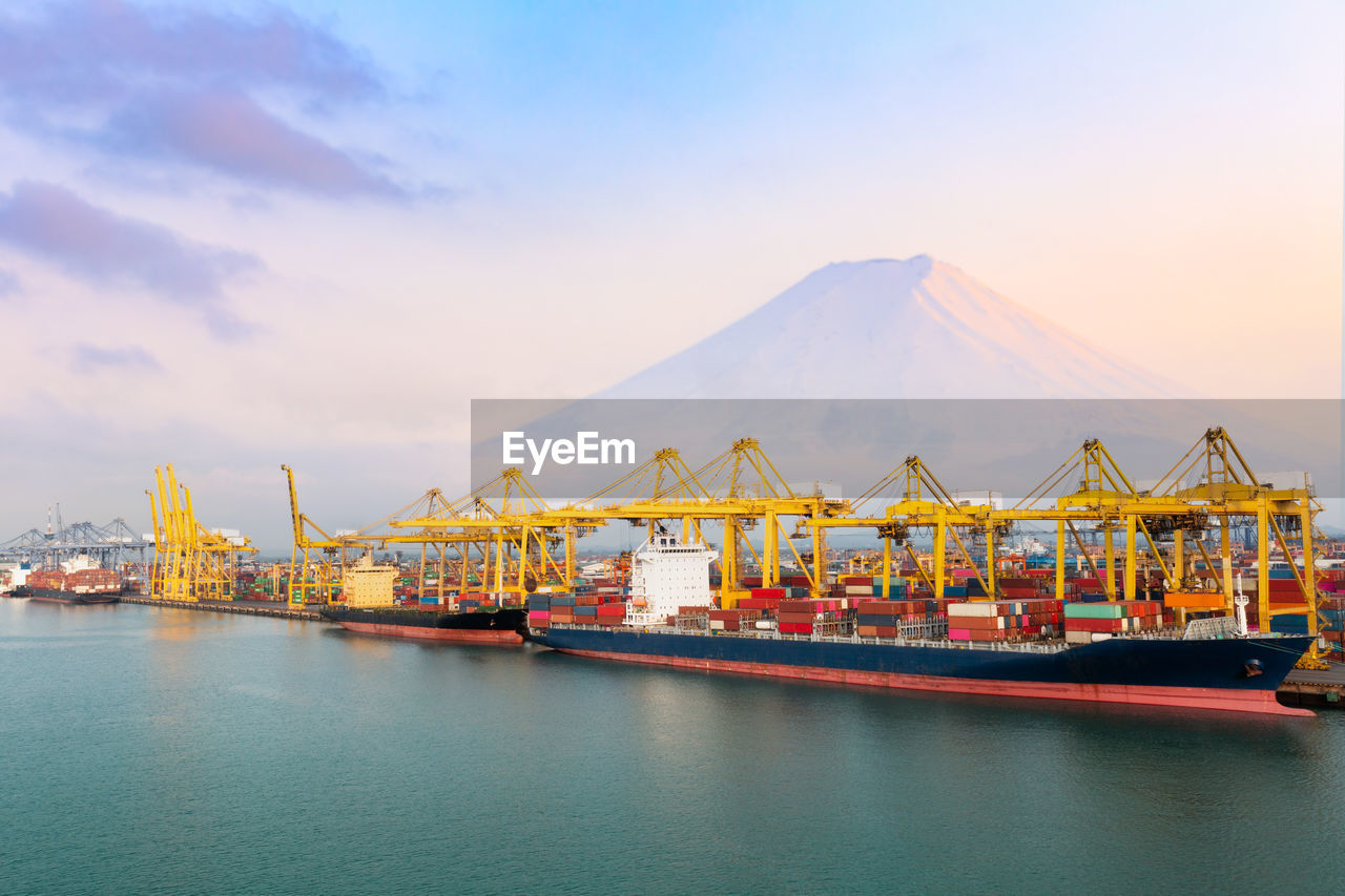 Commercial shipping port and container ship in import export and business cargo logistic, 