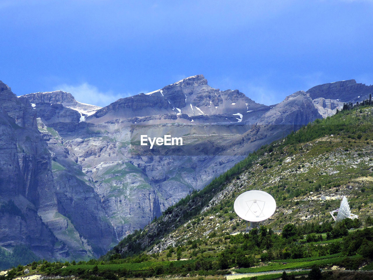 Satterlite dishes oon mountainscape in europe communication technologies