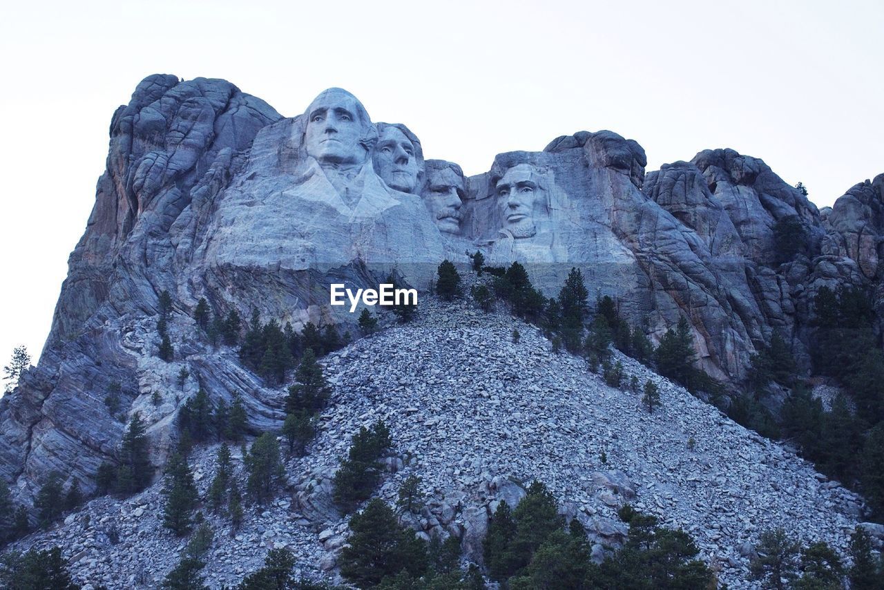 Low angle view of mt rushmore against clear sky