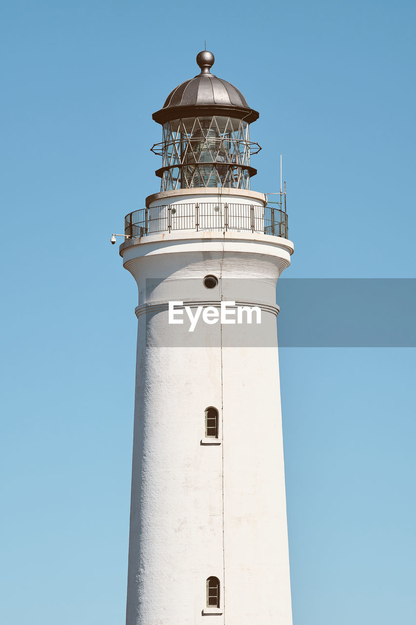 low angle view of lighthouse against clear blue sky