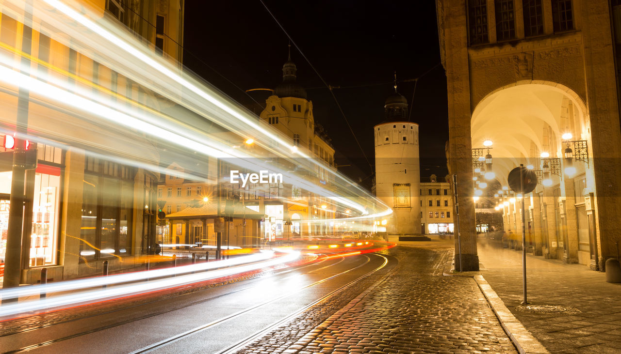 Light trails on illuminated city at night