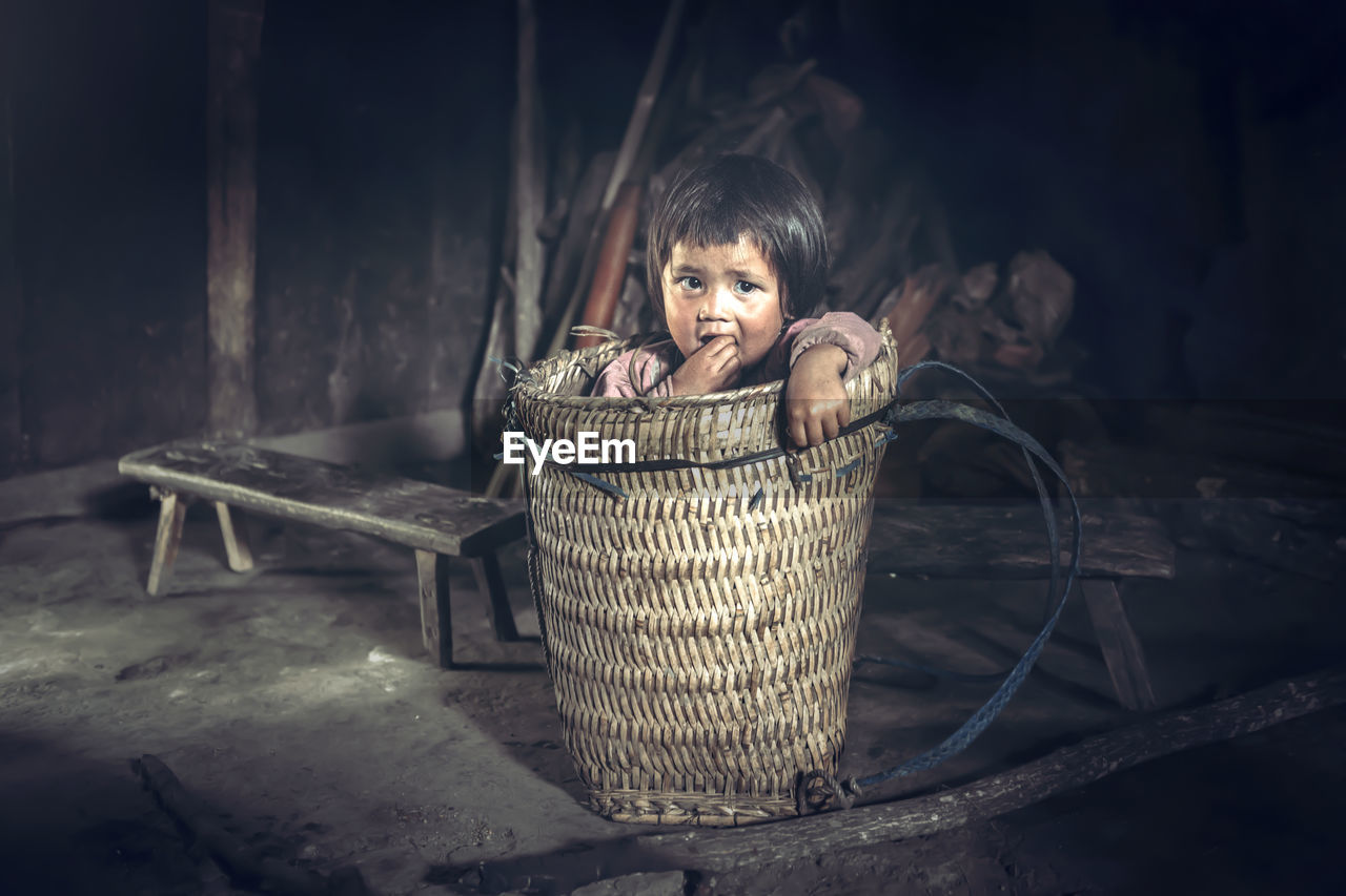 Portrait of girl in basket