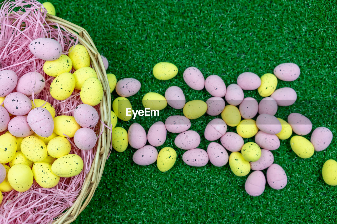 High angle view of multi colored eggs in basket