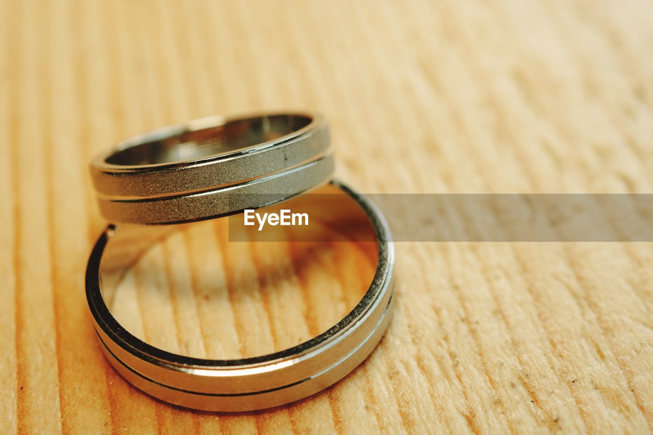 High angle view of wedding rings on table