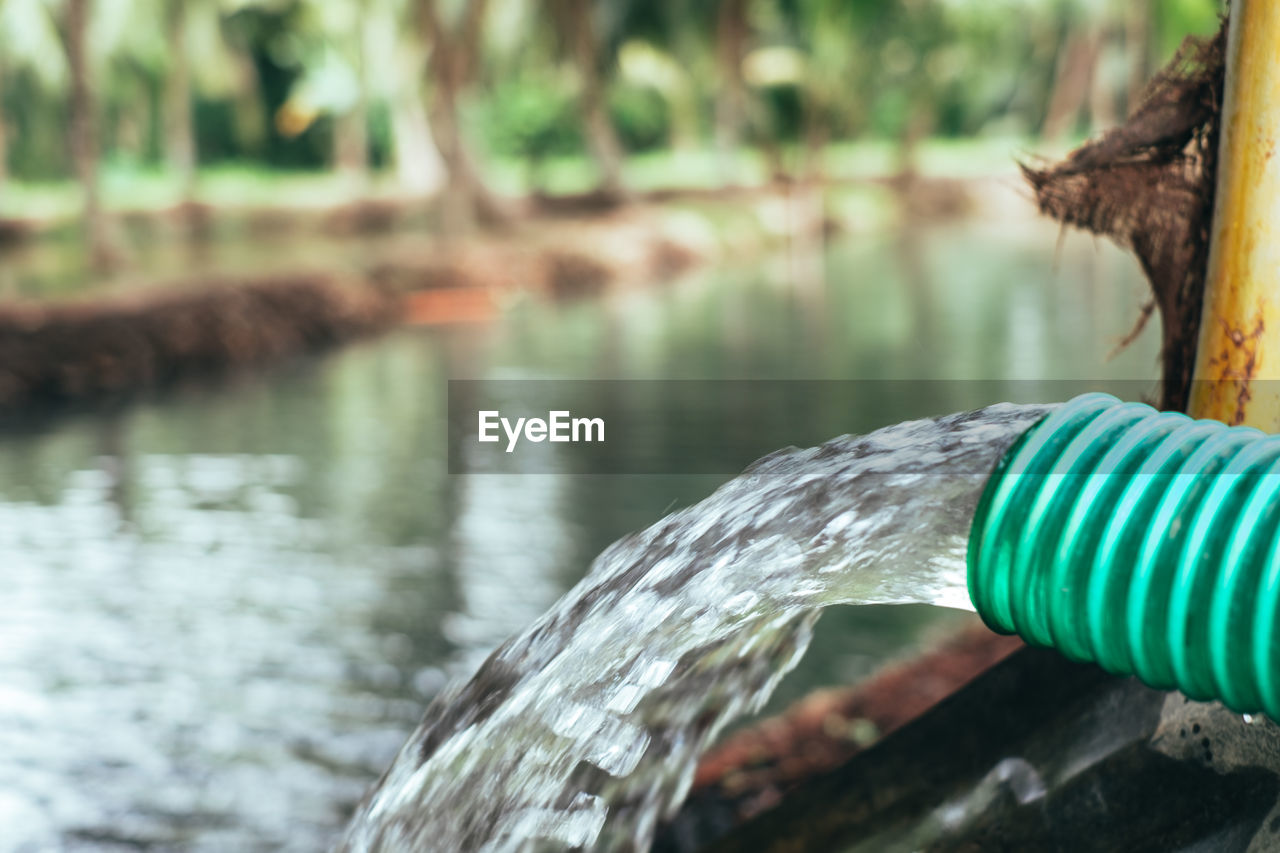 CLOSE-UP OF BLUE WATER PIPE